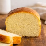 Loaf of Hearth Bread that has been cut with slices laying in front.