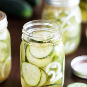 Jar of perfectly chilled and seasoned refrigerator pickles using cucumbers.