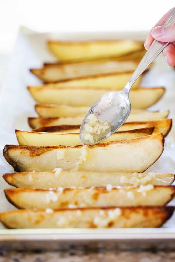 Potato Wedges drizzled in Garlic Sauce