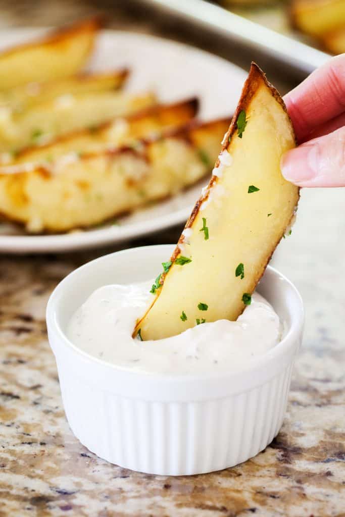 The Perfect Garlic Potato Wedges dipped in Sauce!