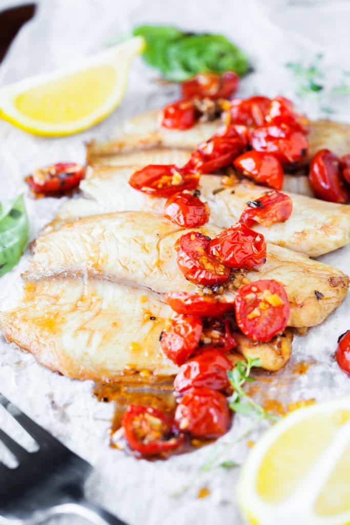 Balsamic Roasted Cherry Tomato Walleye on a Sheet Pan with Lemons on Fork