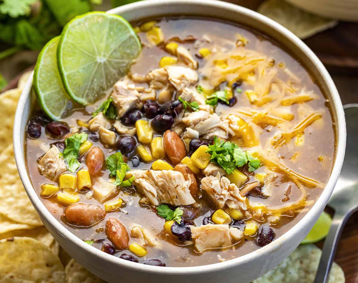 Bowl of 7 Can Chicken Taco Soup with Shredded Cheese and Lime Slices and Chips on the Side. Soup, Summer Soups, Easy Soups, Cheap Soup Recipes, Simple Soups, Chicken Taco Soup, Mexican Soup, Appetizer, Tortilla Chips, Thick Soups, Dinner, Chicken Recipes, recipes, i am homesteader, iamhomesteader