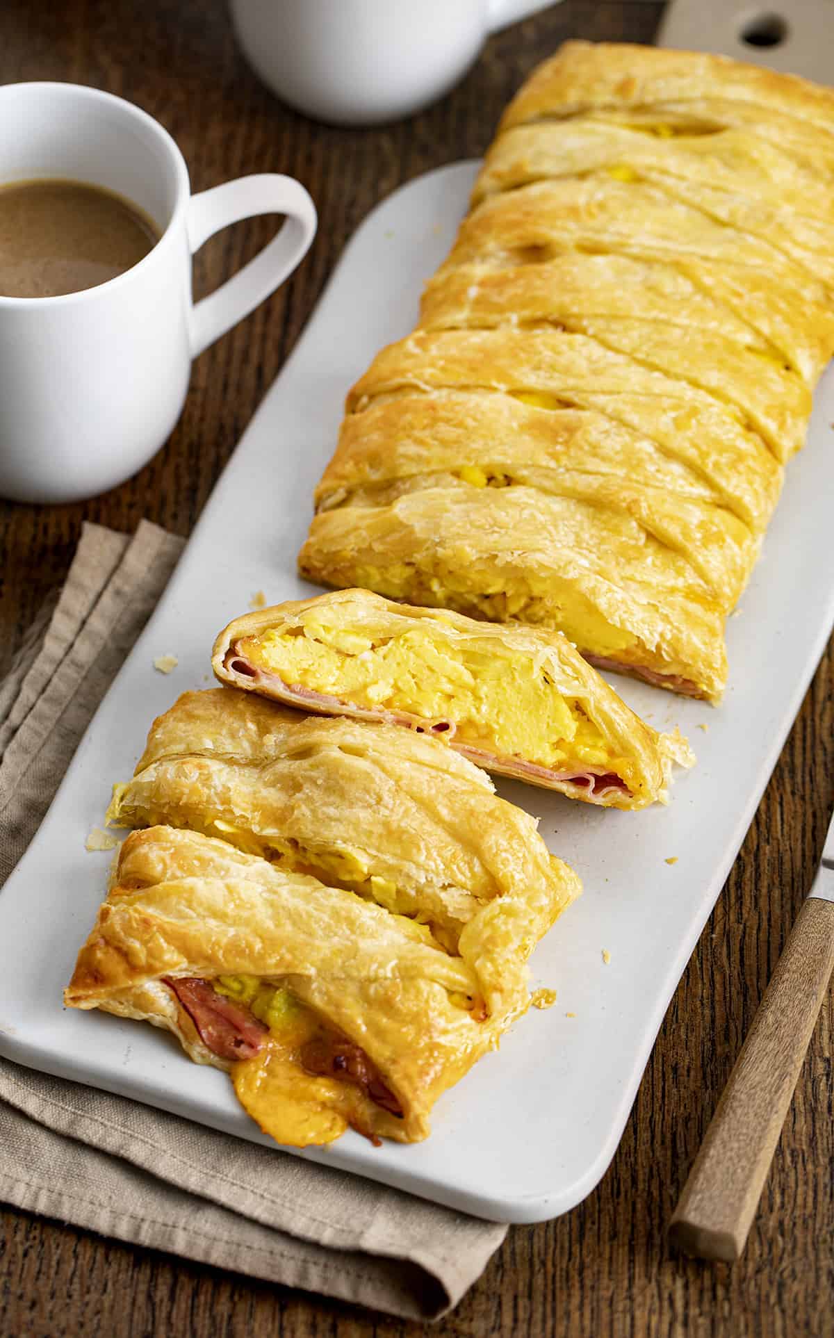 Cut Into and One Piece Showing Interior of Ham & Cheese Breakfast Puff Pastry