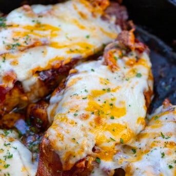 Cheesy Bacon Chicken with Mustard Sauce in a Black Skillet.