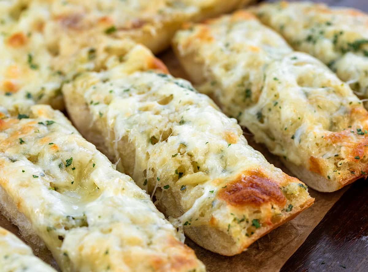 Close up of really cheesy Garlic Cheese Bread cut into slices.