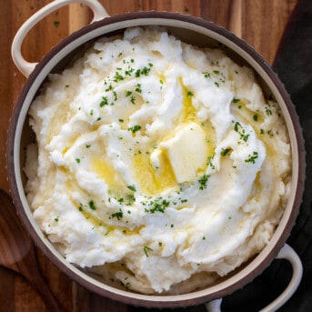 Country Mashed Potatoes in a Bowl with melted Butter from Overhead.