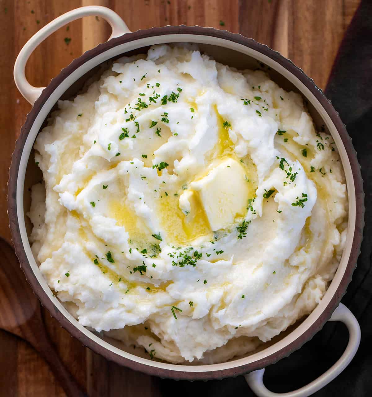 Country Mashed Potatoes in a Bowl with melted Butter from Overhead. 