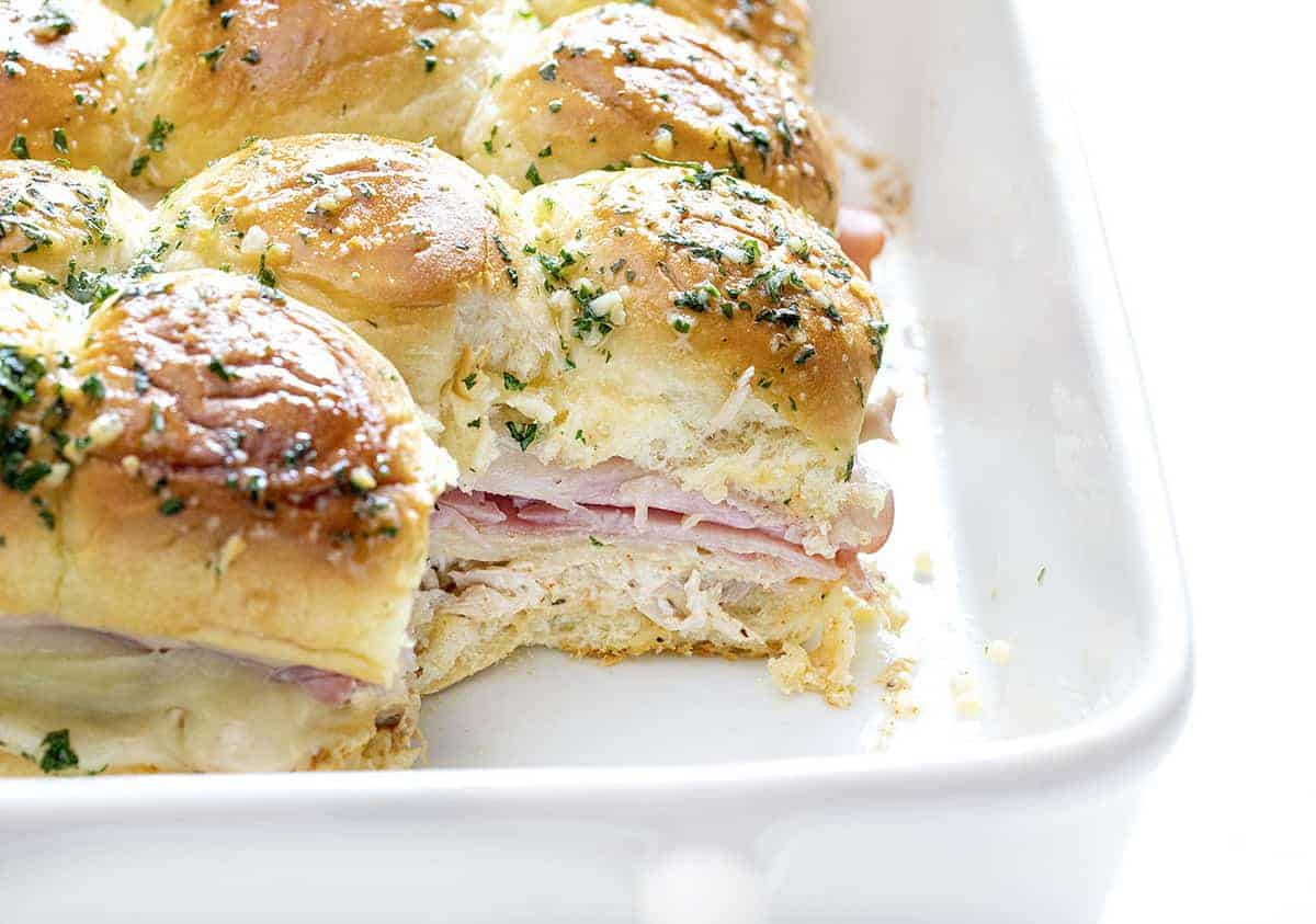Pan of chicken cordon bleu sliders with one missing