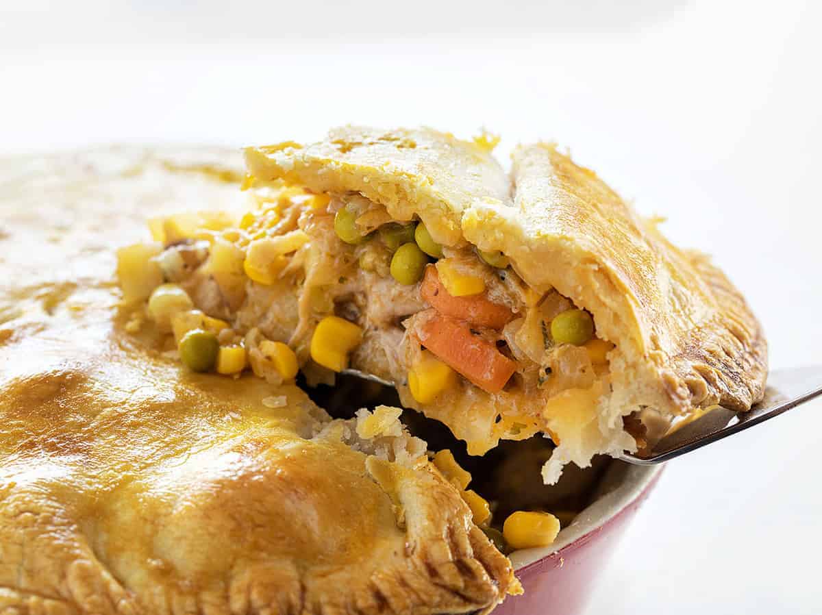 Removing a piece of Chicken Pot Pie from Pan