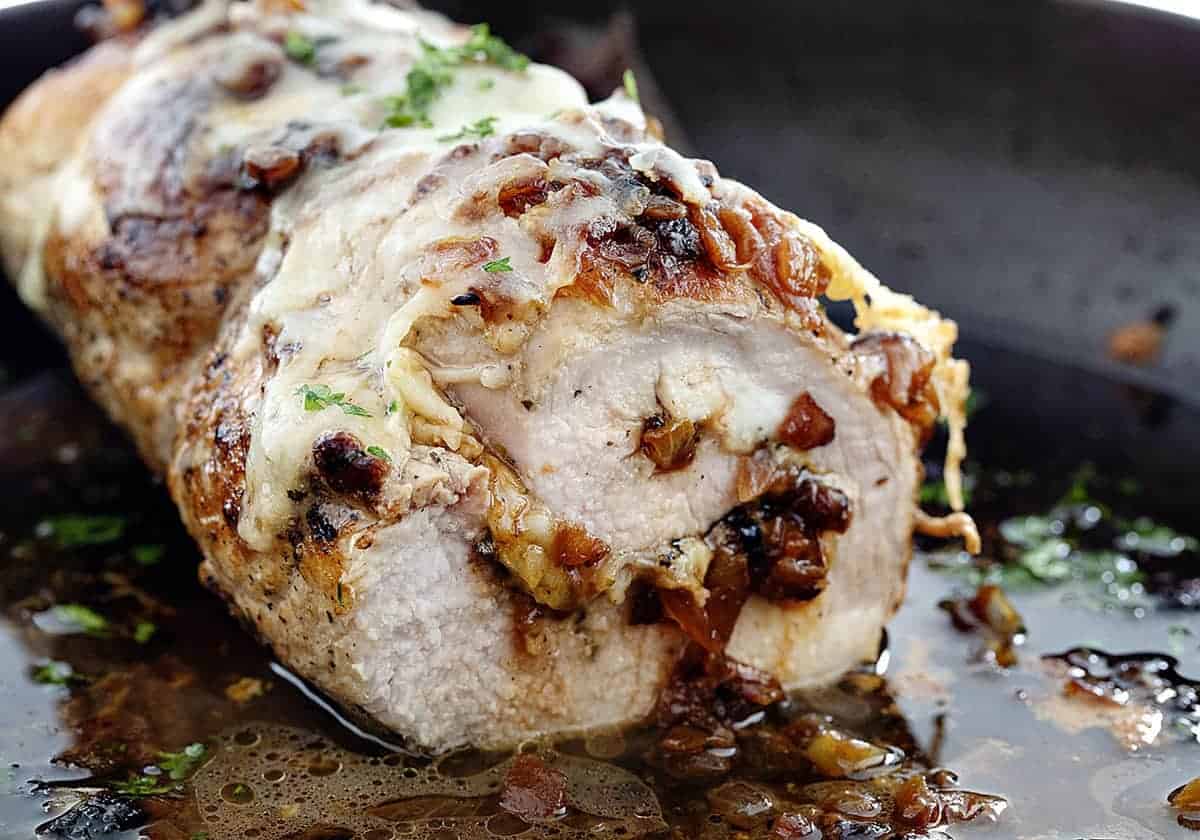 Cut into French Onion Stuffed Pork Loin in a Skillet