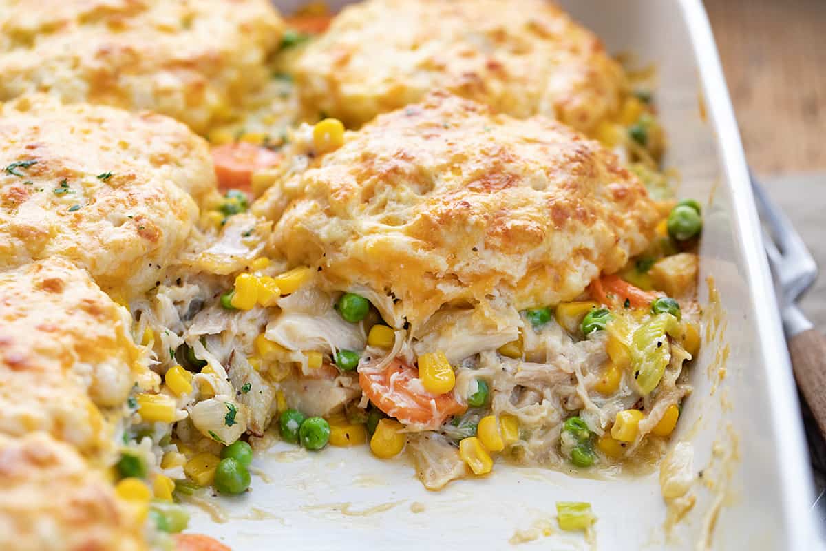 Chicken Pot Pie Casserole in the Pan with One Piece Removed.
