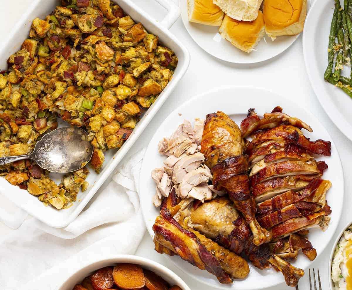 Overhead of Turkey Bacon Stuffing with Thanksgiving side dishes