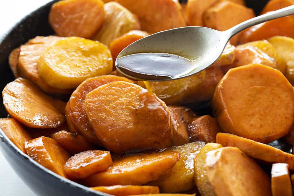Candied Yams are a simple and delicious addition to any holiday menu! This fun and easy version does not have marshmallow and yet still has amazing sweet flavor!
