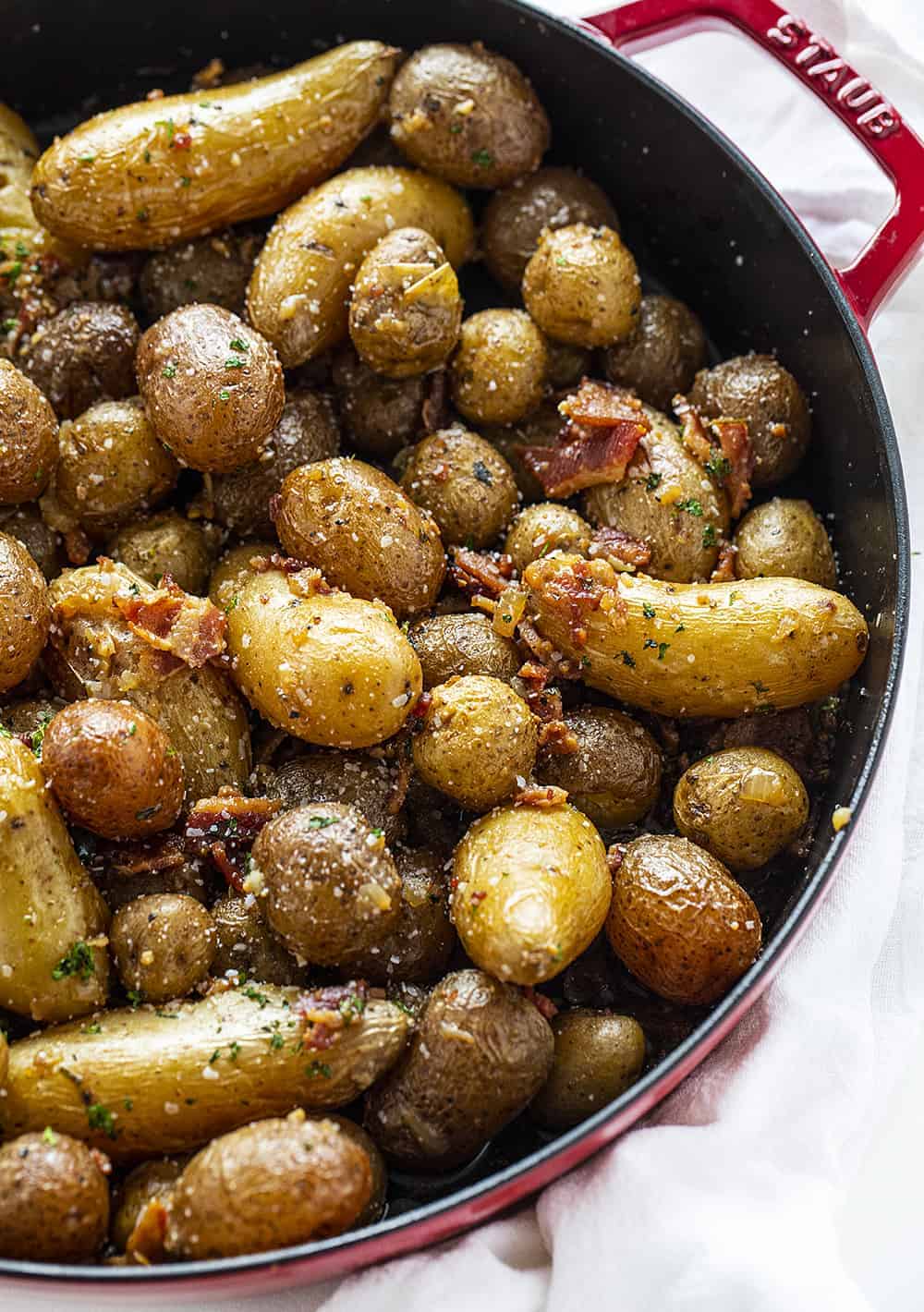 Roasted Potatoes with Bacon in a Red Skillet