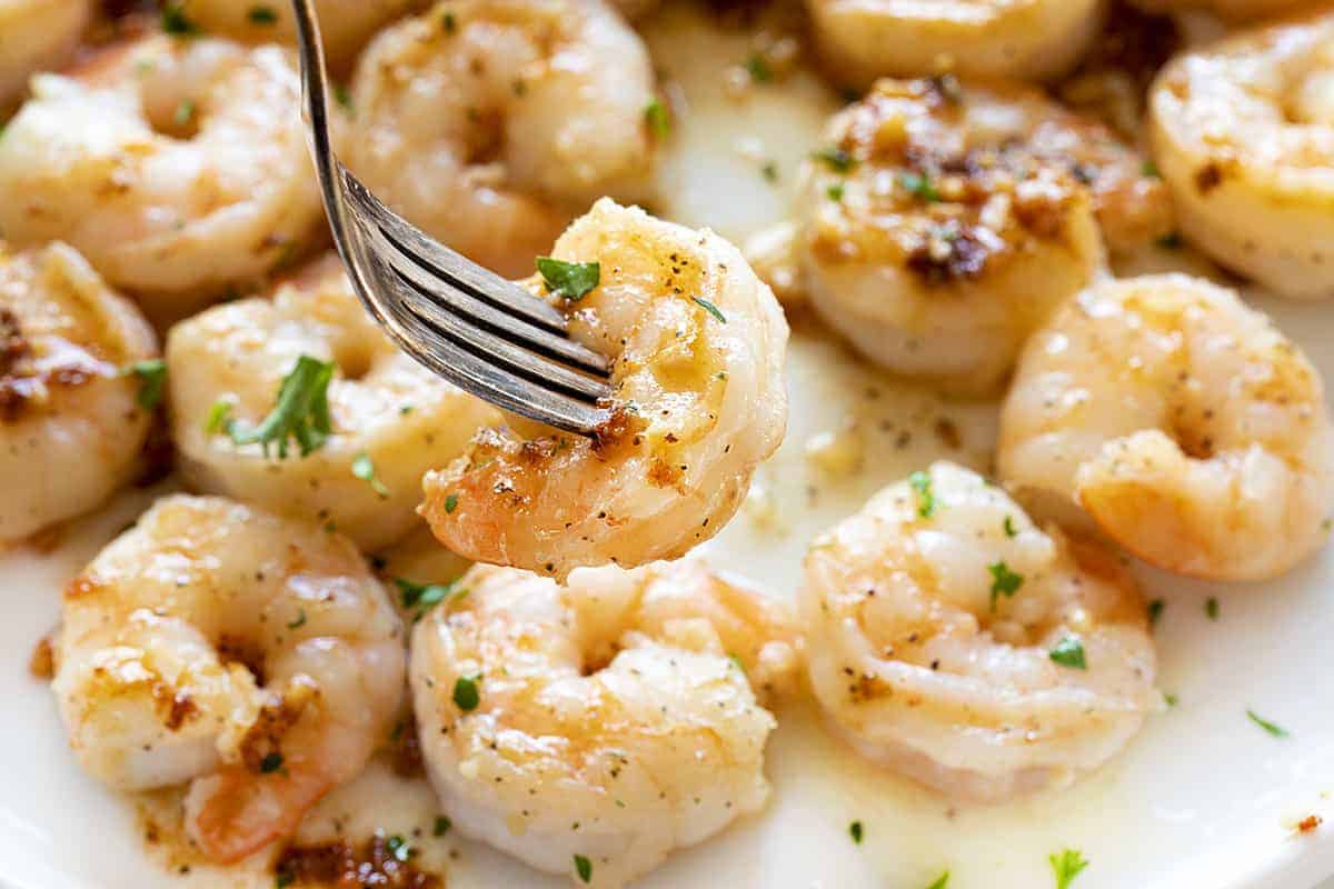 Fork with Shrimp Scampi on a White Plate