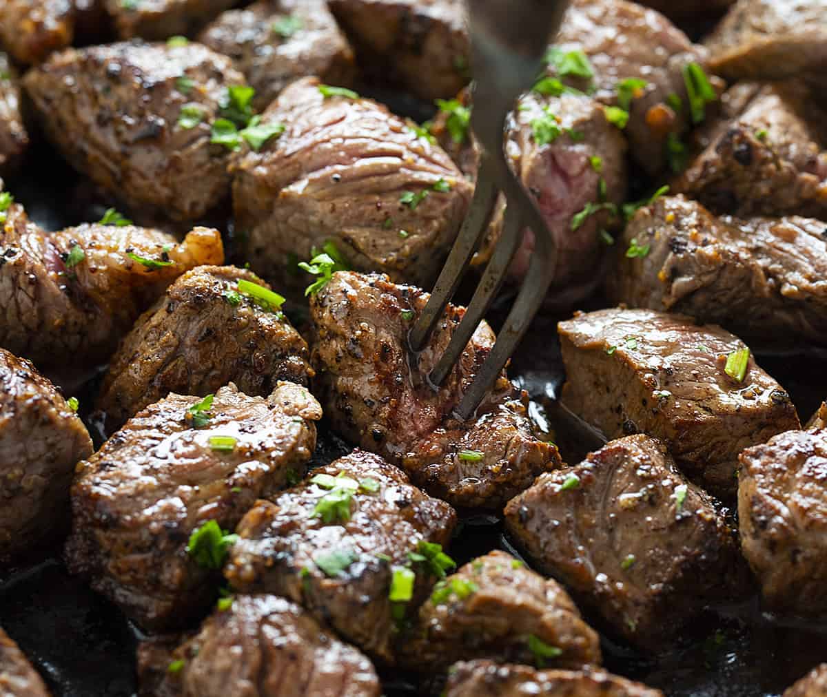 Putting a fork into one of the Steak Bites