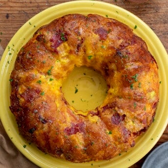 Breakfast Monkey Bread from Overhead on a Yellow Plate. Breakfast, Breakfast Recipes, Easy Breakfast Idea, Monkey Bread, Breakfast for a Crowd, Holiday Breakfast Ideas, Savory Bread, Baking, recipes, i am homesteader, iamhomesteader