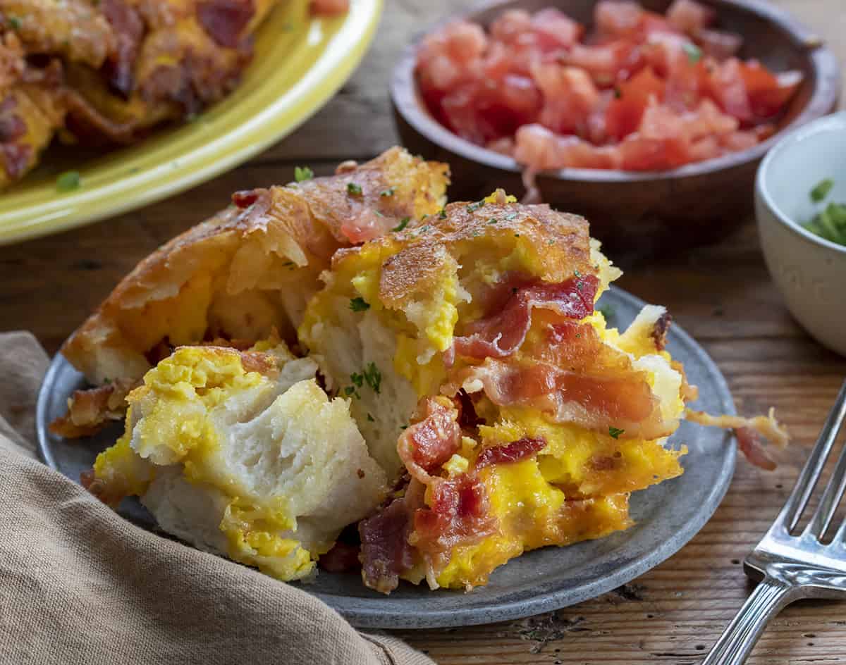 Pieces of Breakfast Monkey Bread on a Plate. Breakfast, Breakfast Recipes, Easy Breakfast Idea, Monkey Bread, Breakfast for a Crowd, Holiday Breakfast Ideas, Savory Bread, Baking, recipes, i am homesteader, iamhomesteader