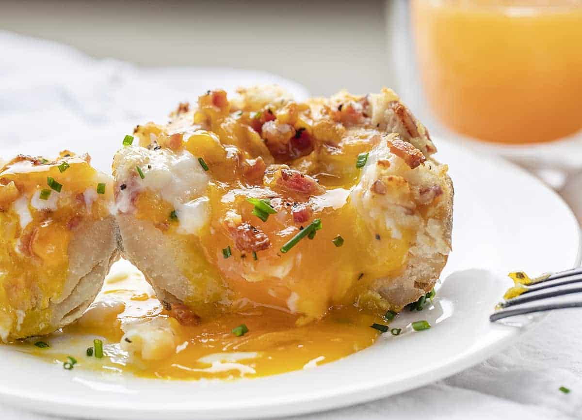 Breakfast Twice Baked Potato Cut Into and Over Easy Egg Spilling Out