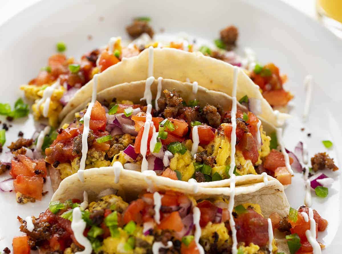 Breakfast Tacos with Sour Cream Drizzled on Top
