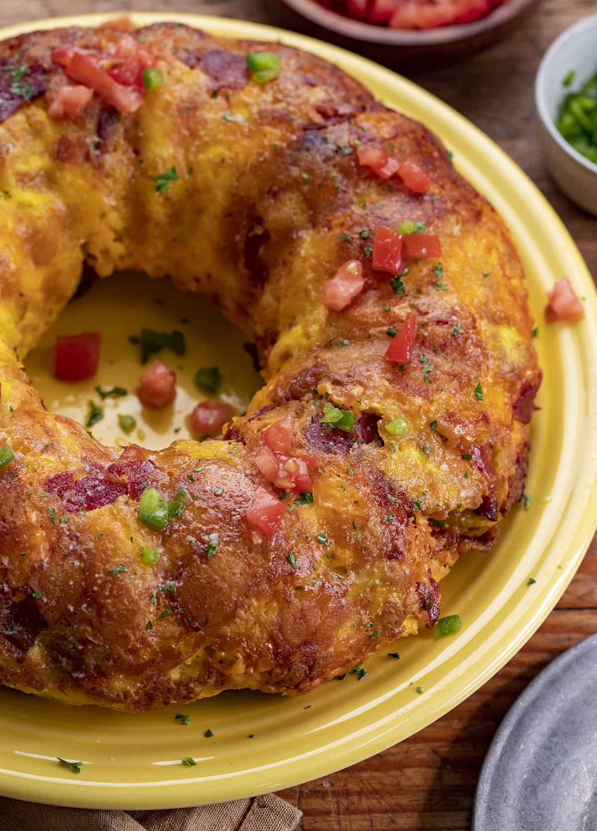 Close up of Breakfast Monkey Bread on a Yellow Plate. Breakfast, Breakfast Recipes, Easy Breakfast Idea, Monkey Bread, Breakfast for a Crowd, Holiday Breakfast Ideas, Savory Bread, Baking, recipes, i am homesteader, iamhomesteader