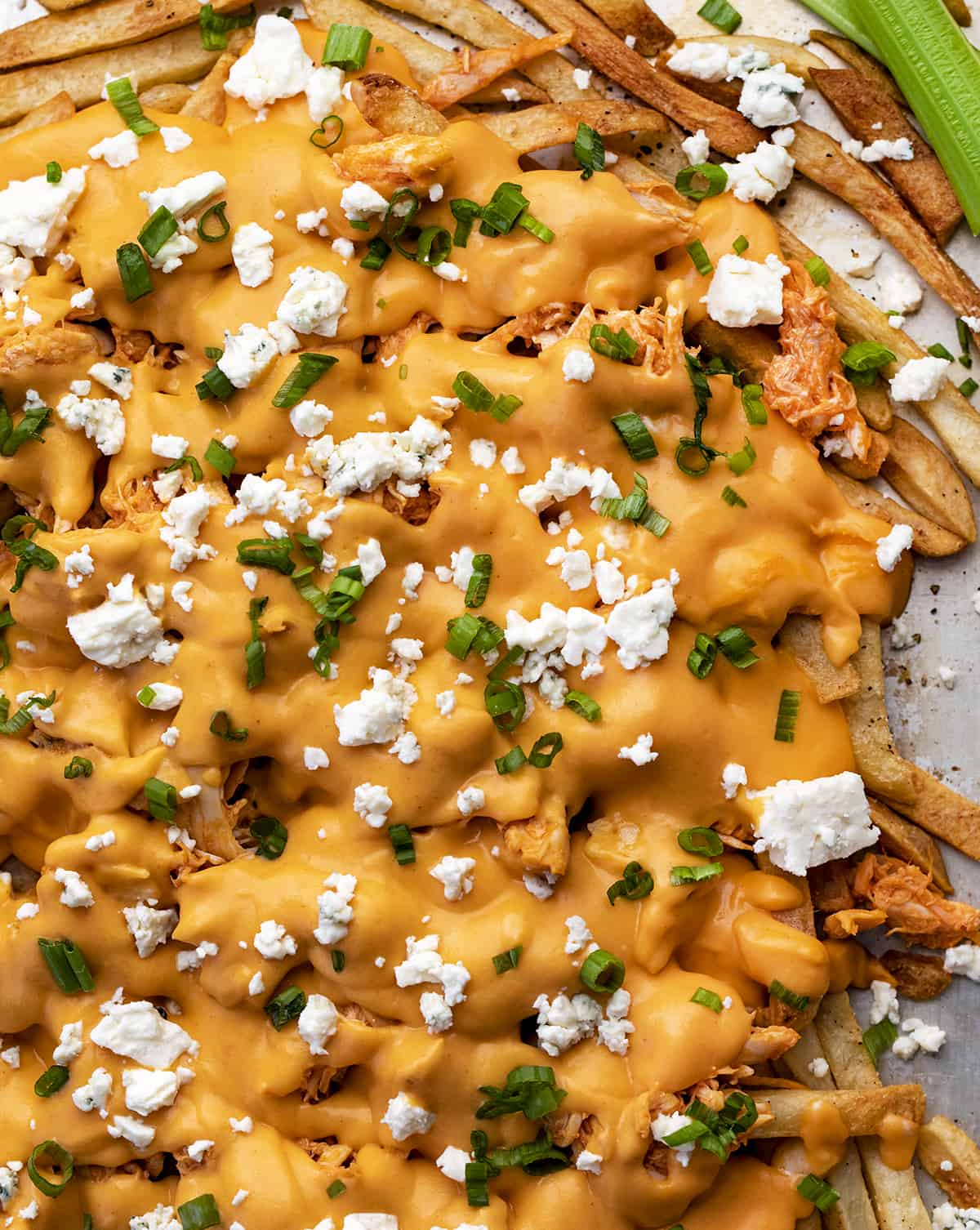 Buffalo Chicken Cheesy Fries on a Sheet Pan with Green Onion and Blue Cheese. Appetizer, Super Bowl Food, Football Recipes, Cheesy Fries, Buffalo Chicken Recipes, Buffalo Chicken Sauce, i am homesteader, iamhomesteader