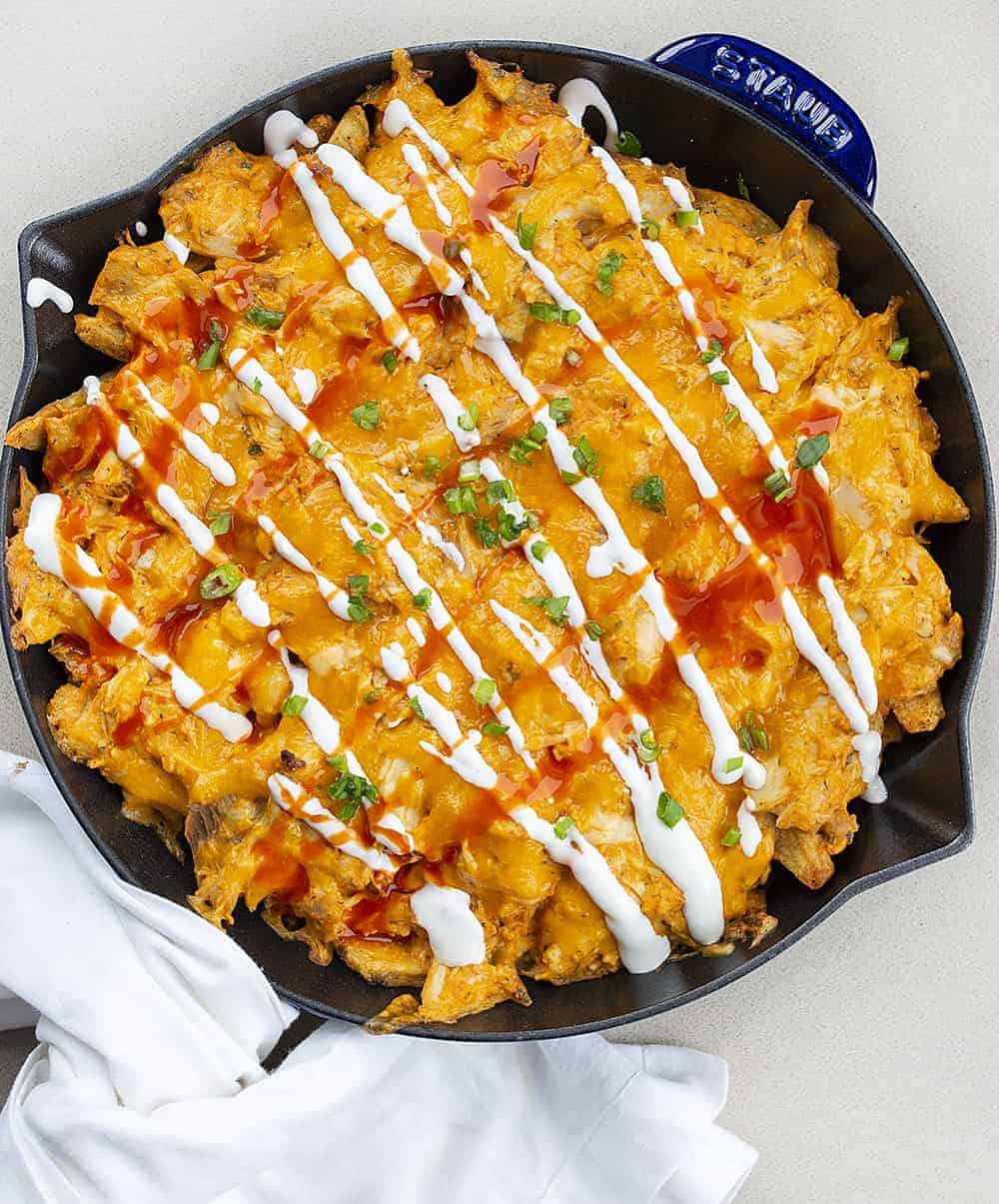 Overhead View of Buffalo Chicken Cheesy Fries in Blue Staub Skillet