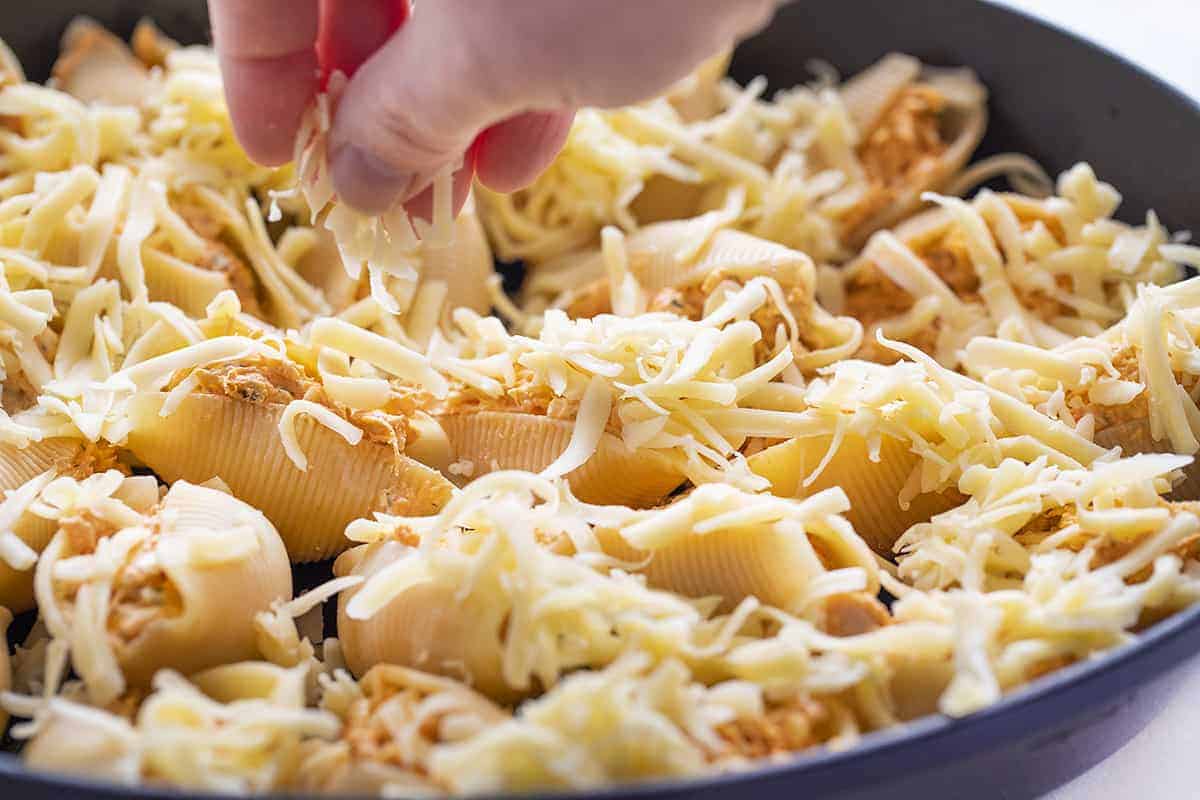 Spreading Cheese on Buffalo Chicken Stuffed Shells