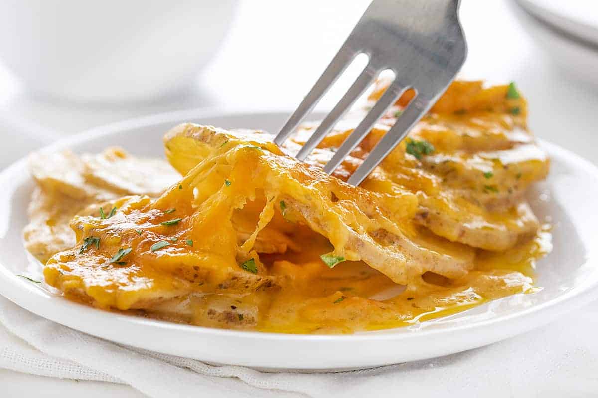 Fork of Cheesy Scalloped Potatoes with Ranch Seasoning 