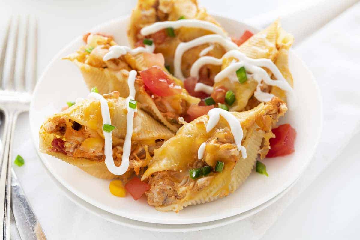 Chicken Taco Stuffed Shells on a White Plate with Fork