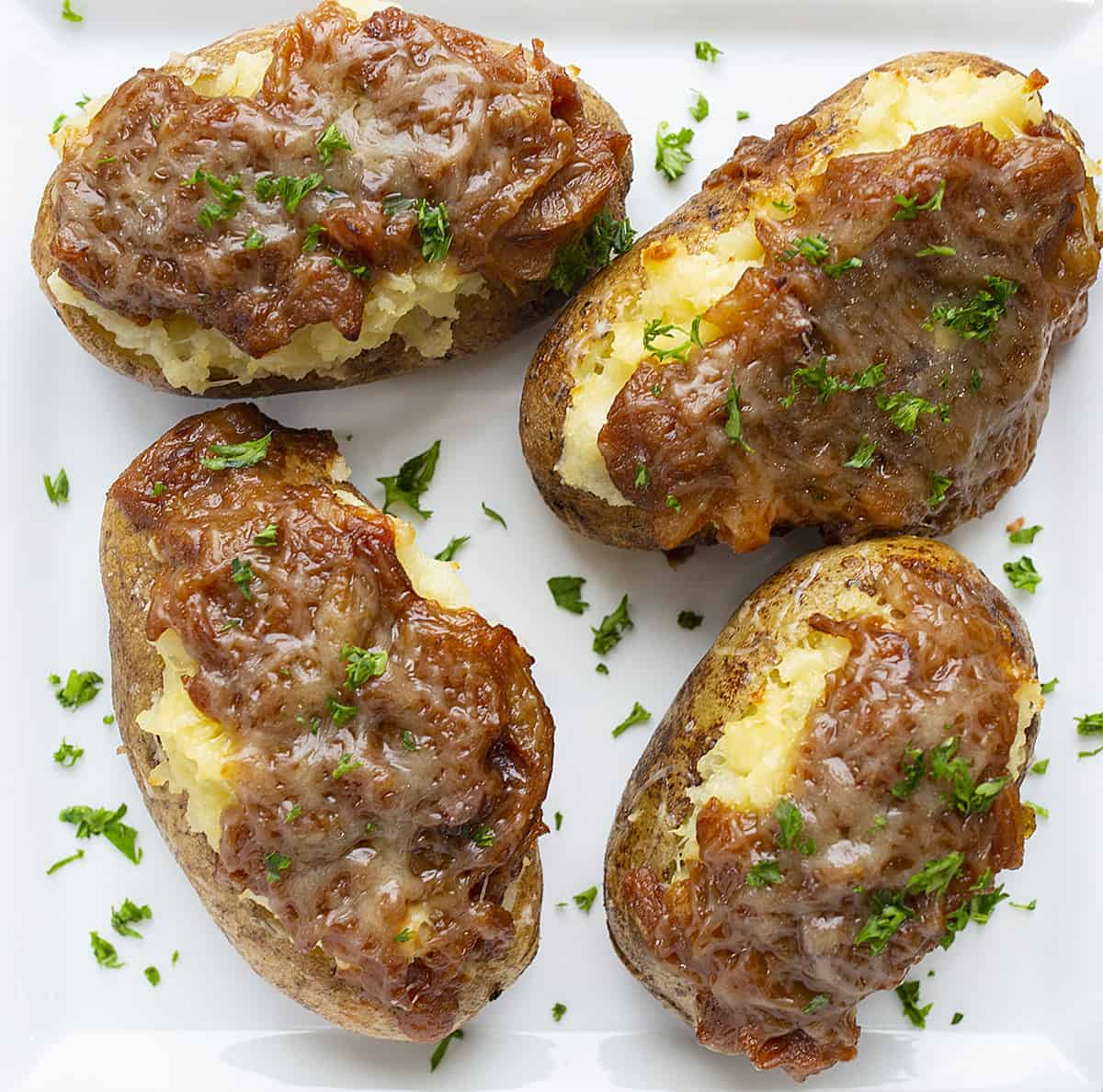 Overhead of French Onion Twice Baked Potatoes on White Plate