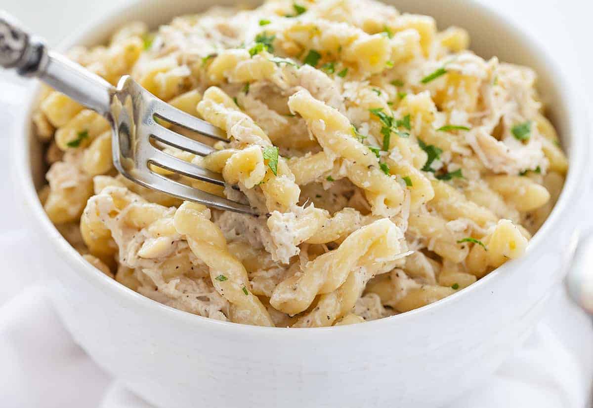 Easy Lemon Chicken Pasta on a Fork in a White Bowl