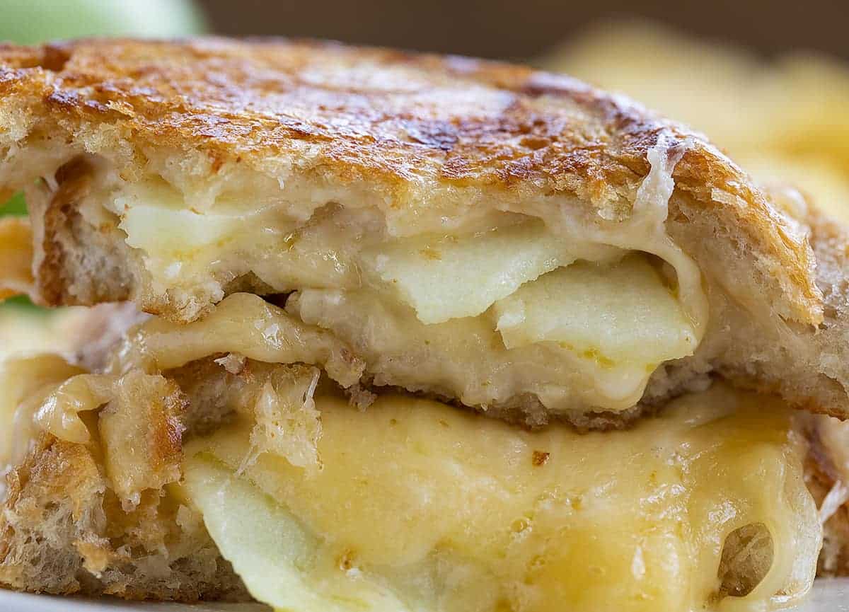 Bite Taken out of Apple Gouda Grilled Cheese Sandwich