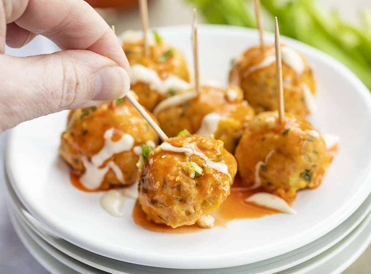 Buffalo Chicken Meatballs on a Toothpick on White Plate