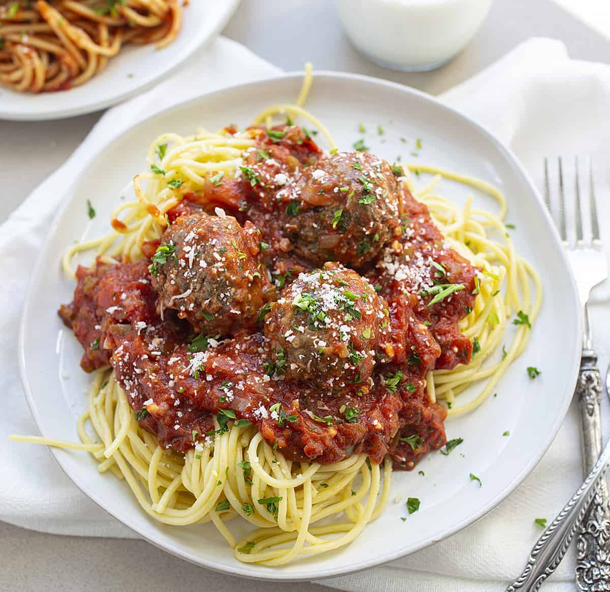 Spaghetti and Meatballs on a White Plate 