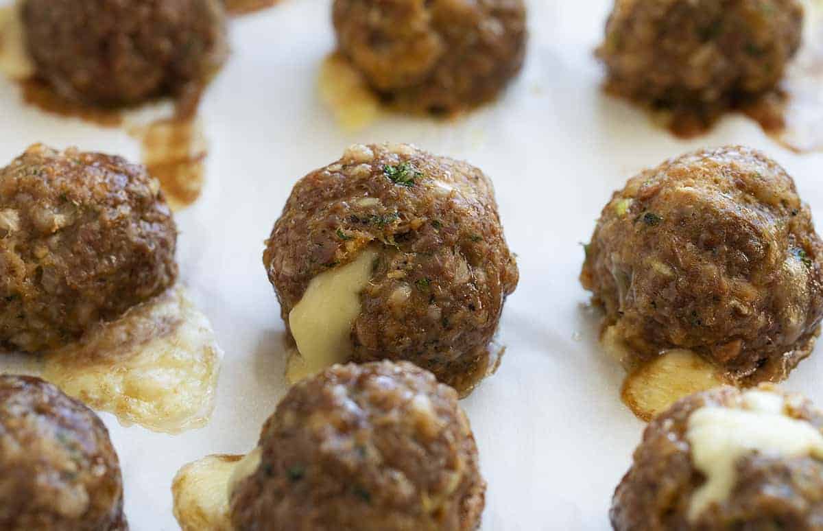 Gooey Cheese Oozing Out of Cooked Meatball