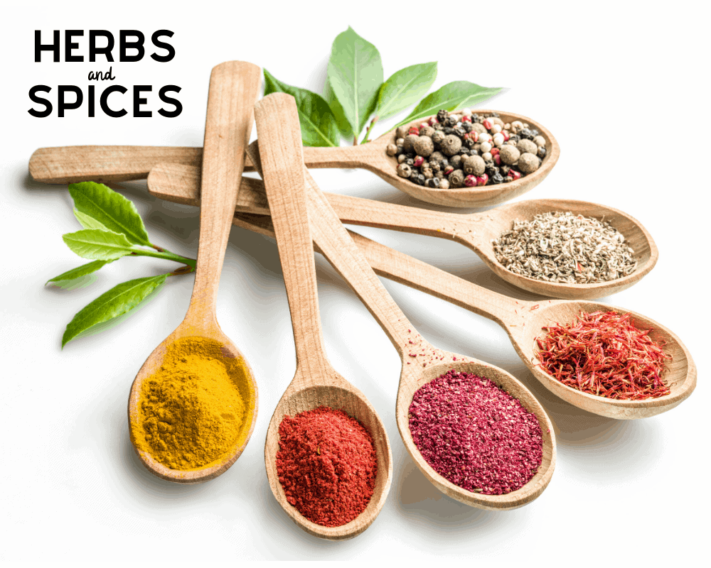 Necessary Herbs and Spices in wooden spoons laid out