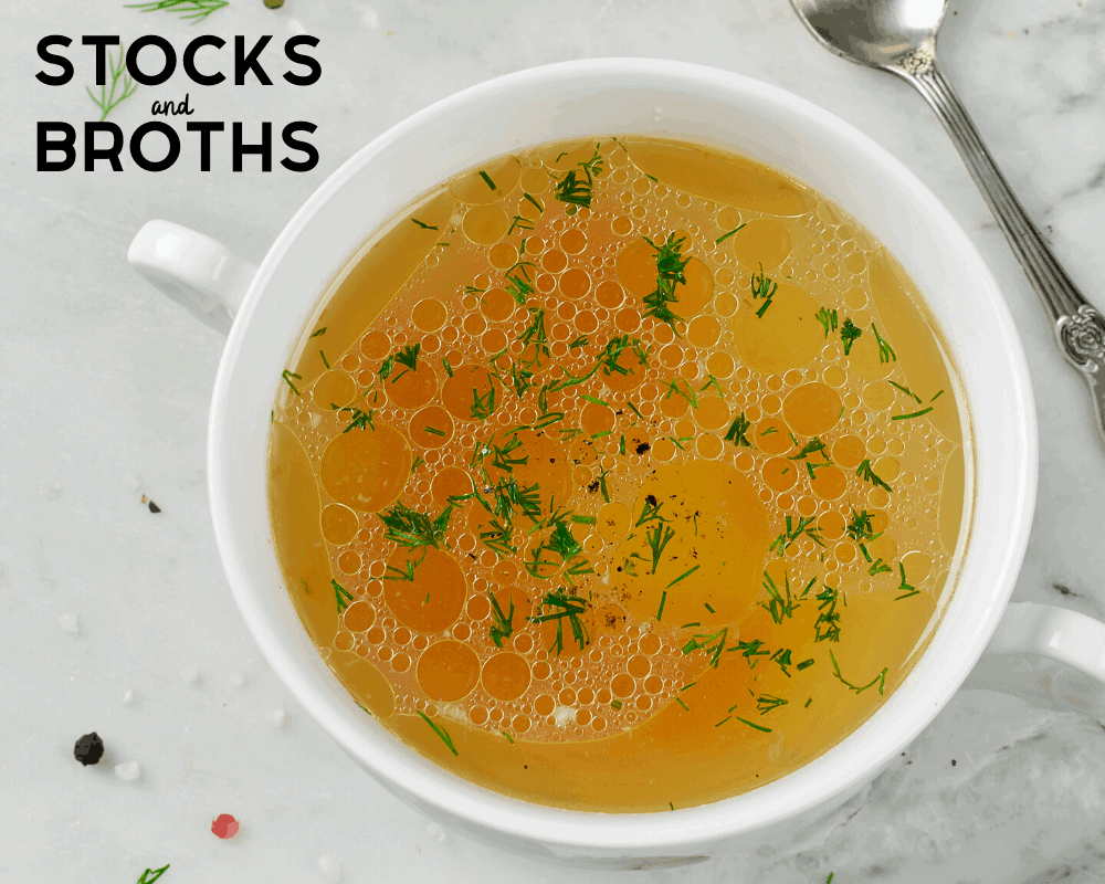 Stocks and Broths in white bowl with spoon