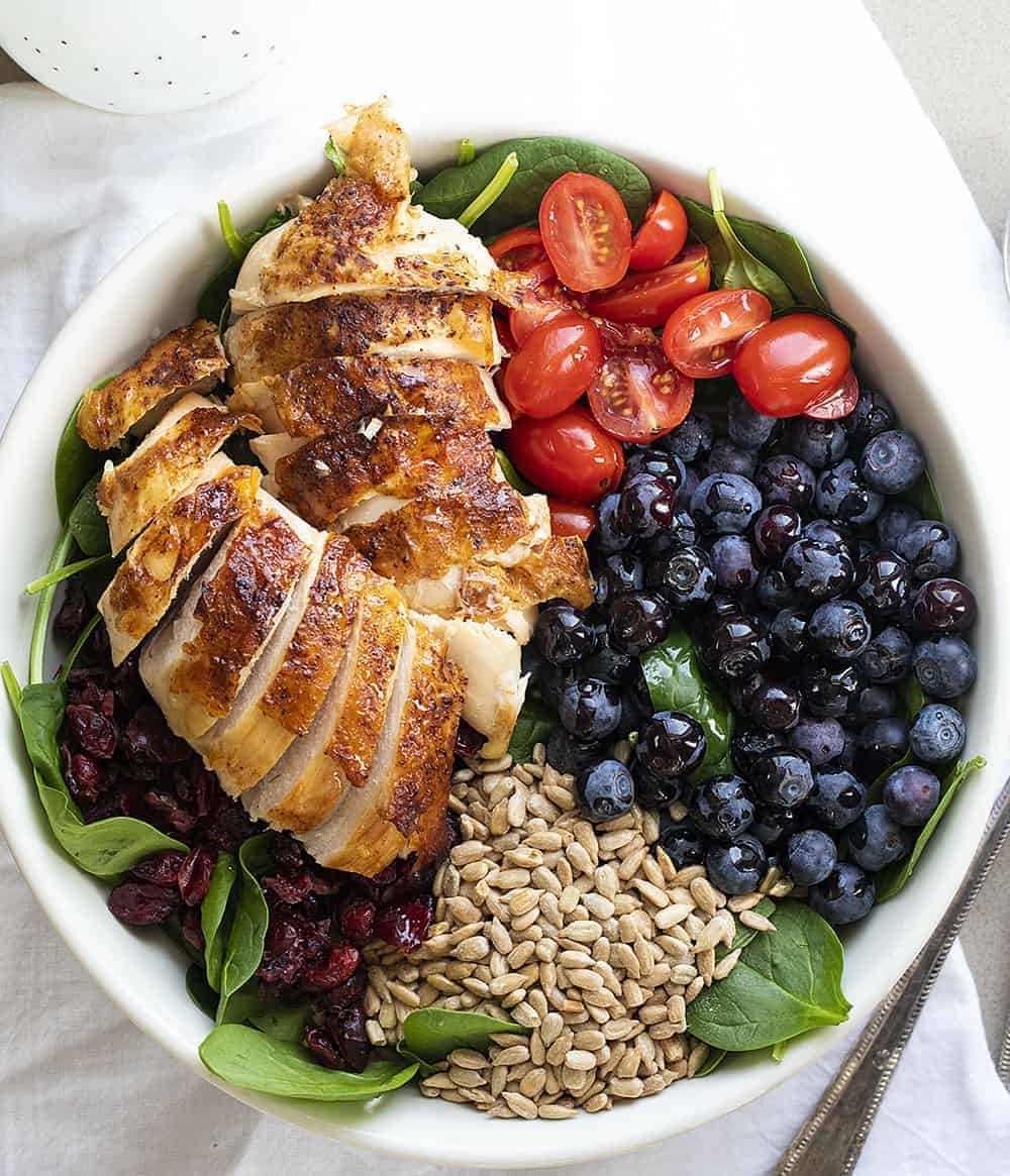 Overhead of Blueberry Spinach Salad Ingredients in White Bowl