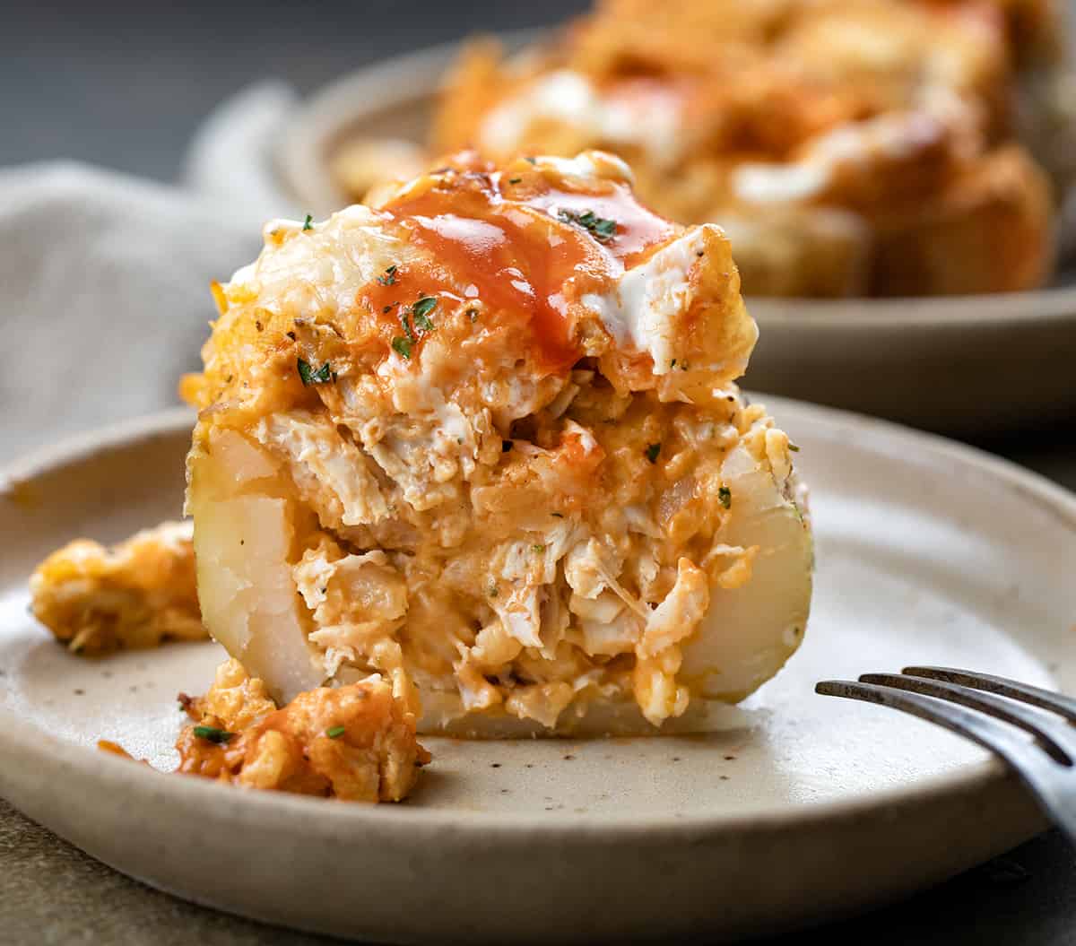 Cut in Half Buffalo Chicken Twice Baked Potato Showing Texture Inside.