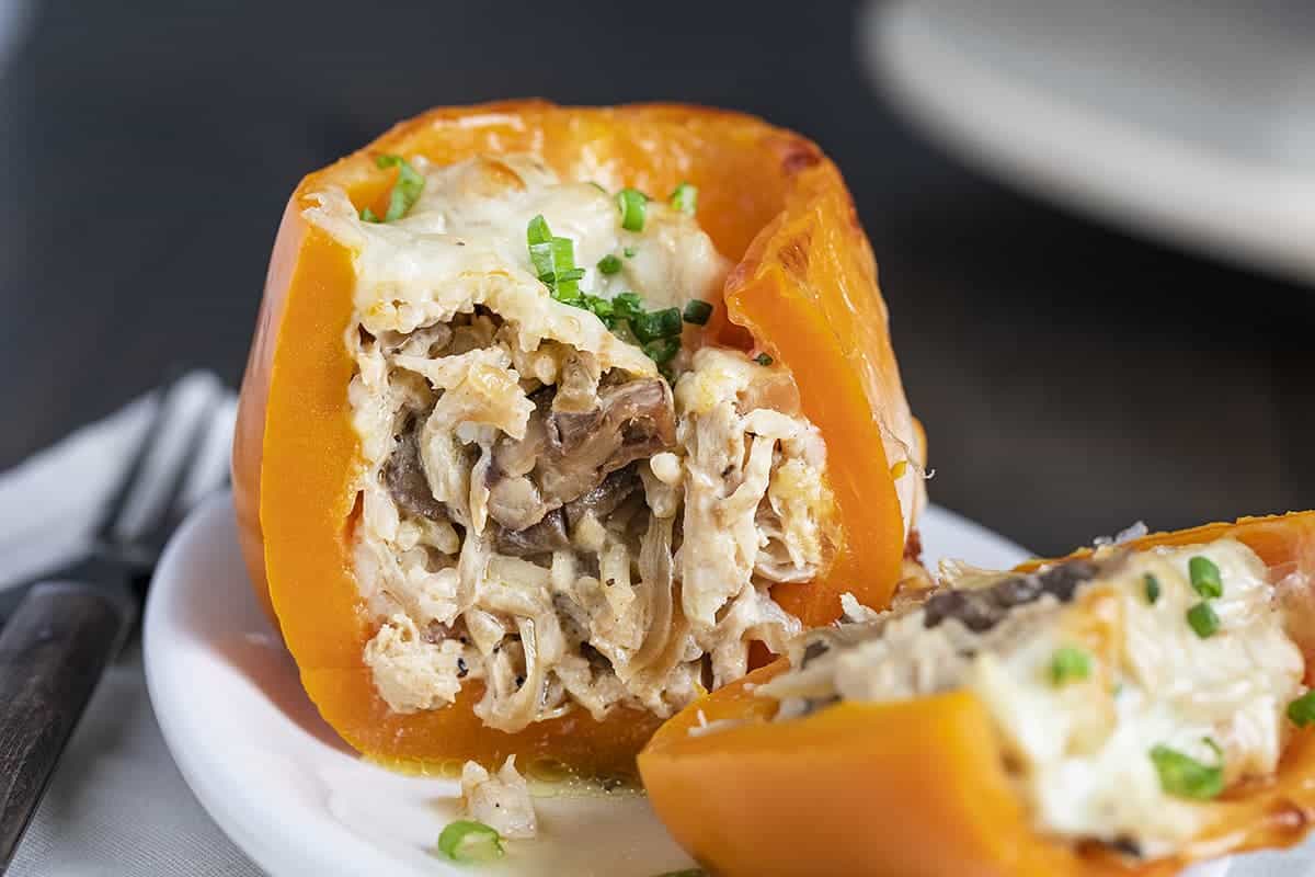 Cut Into Chicken Mushroom Stuffed Pepper on White Plate