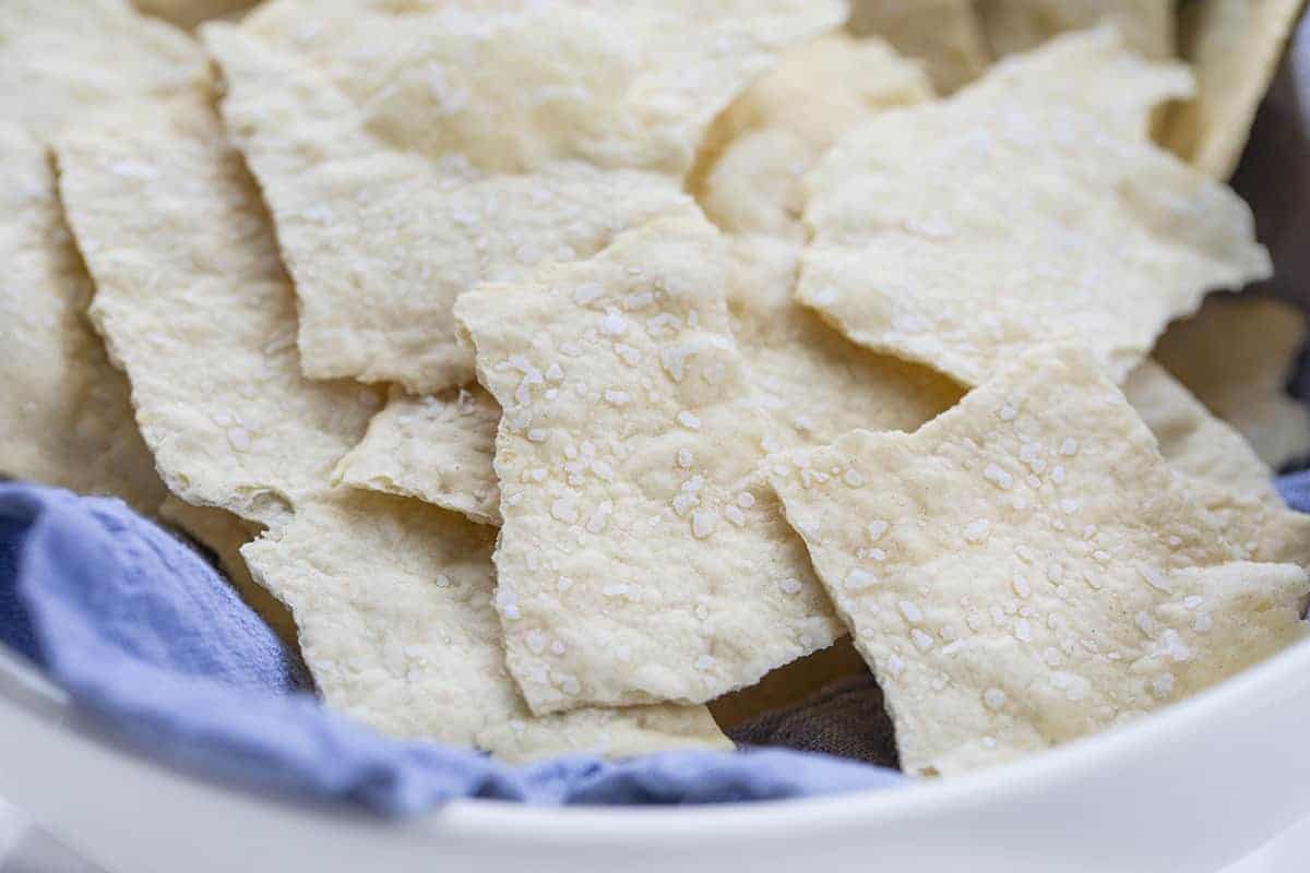 Homemade Sourdough Crackers in a Bowl with Blue Towel