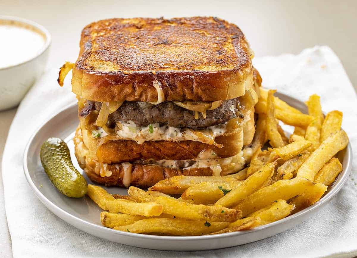 Double Decker Patty Melt on Plate with Fries and Pickle