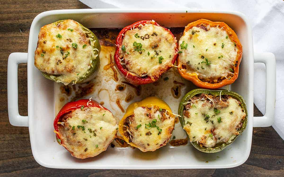 Overhead Image of Stuffed Peppers in White Casserole Pan