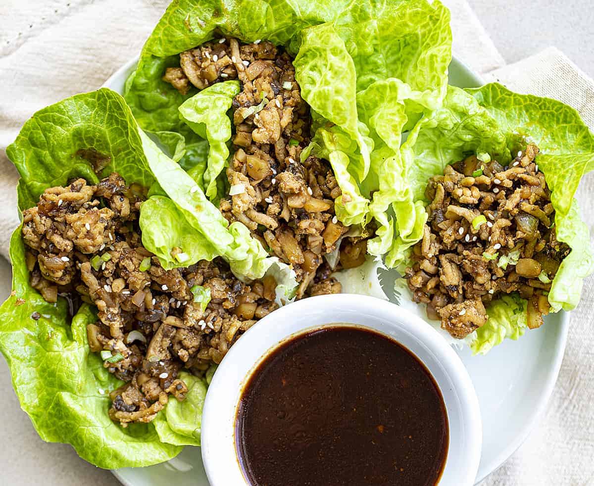 Overhead of Chicken Lettuce Wraps on White Plate with Sauce