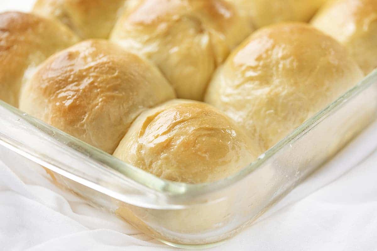 Texas Roadhouse Rolls In Baking Pan with Butter Brushed on Top