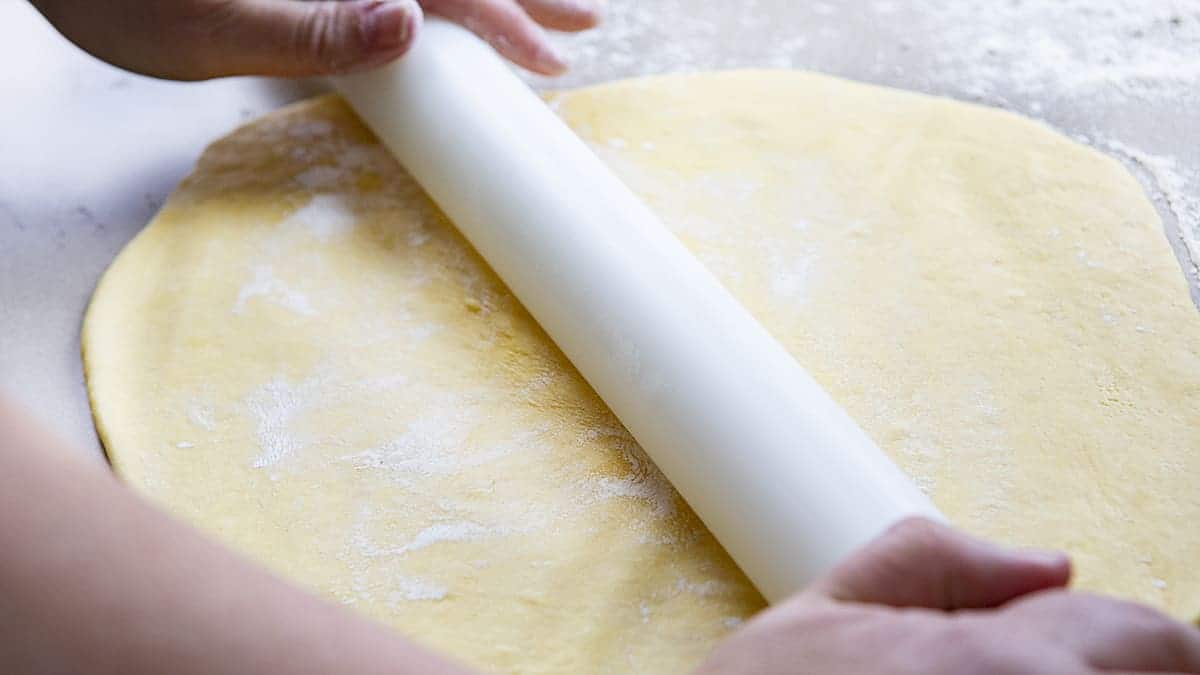 Rolling out Sourdough Pasta Noodles with White Rolling Pin