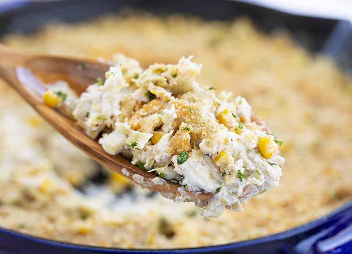 Spoonful of Copycat Cheesecake Factory Warm Crab and Artichoke Dip Just Scooped from Blue Skillet 