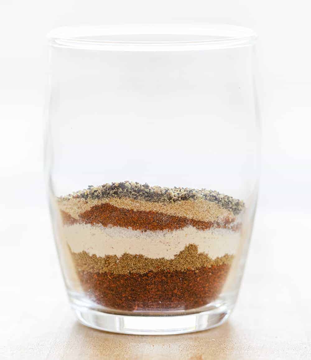 Layers of Spices before being Mixed for Homemade Chili Powder in a Glass Jar