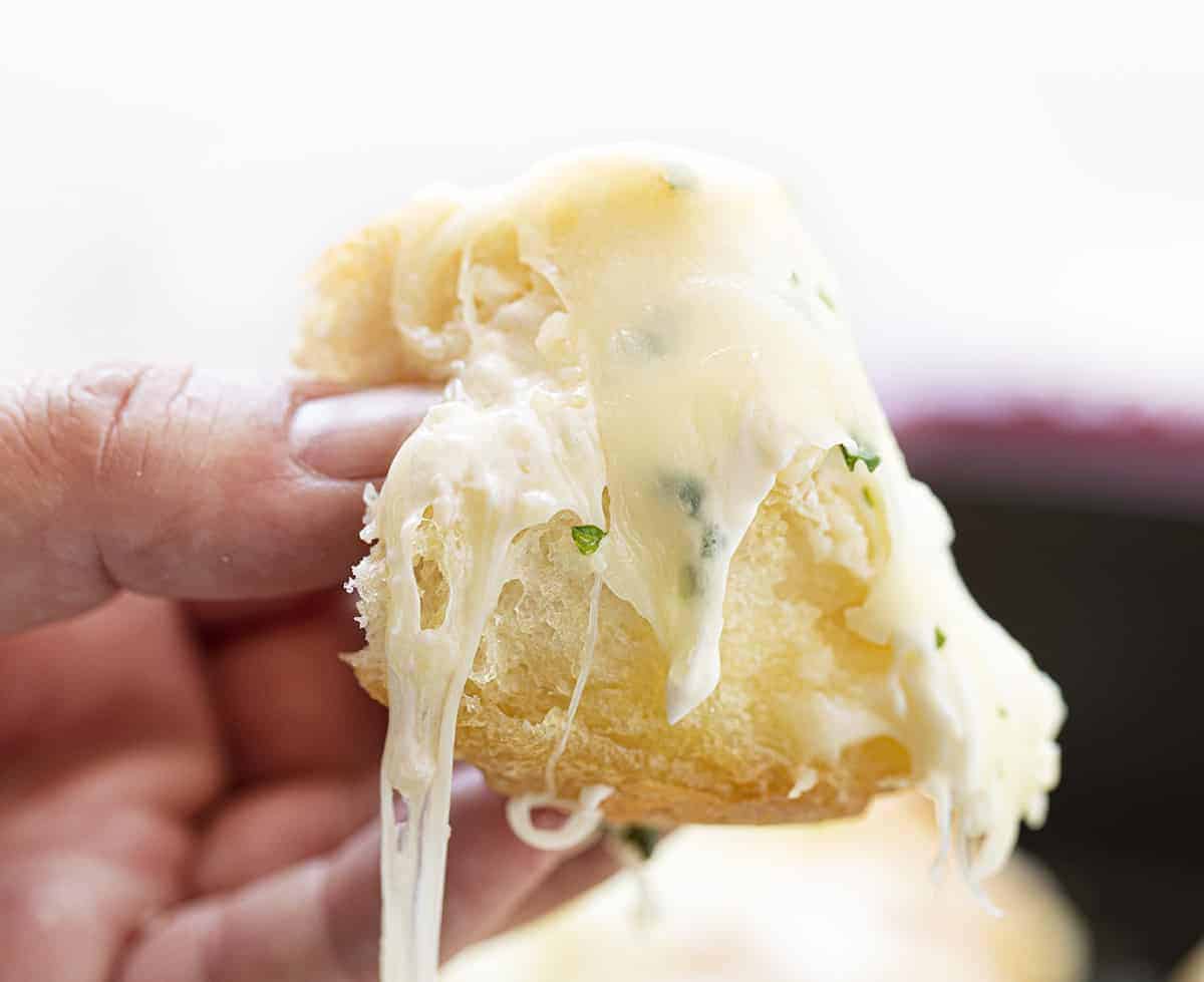 Cheesy Garlic Pull Apart Bread Being Held up by a Hand
